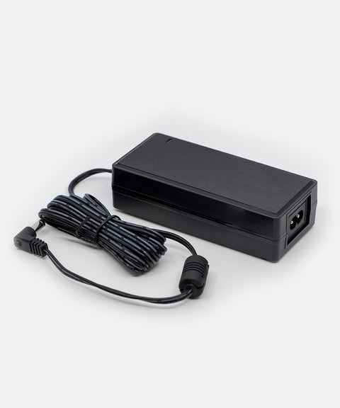 NEOZ 50W power supply with coiled DC cable – compact black charger for Small Charging Tray supporting up to 4 cordless lamps.