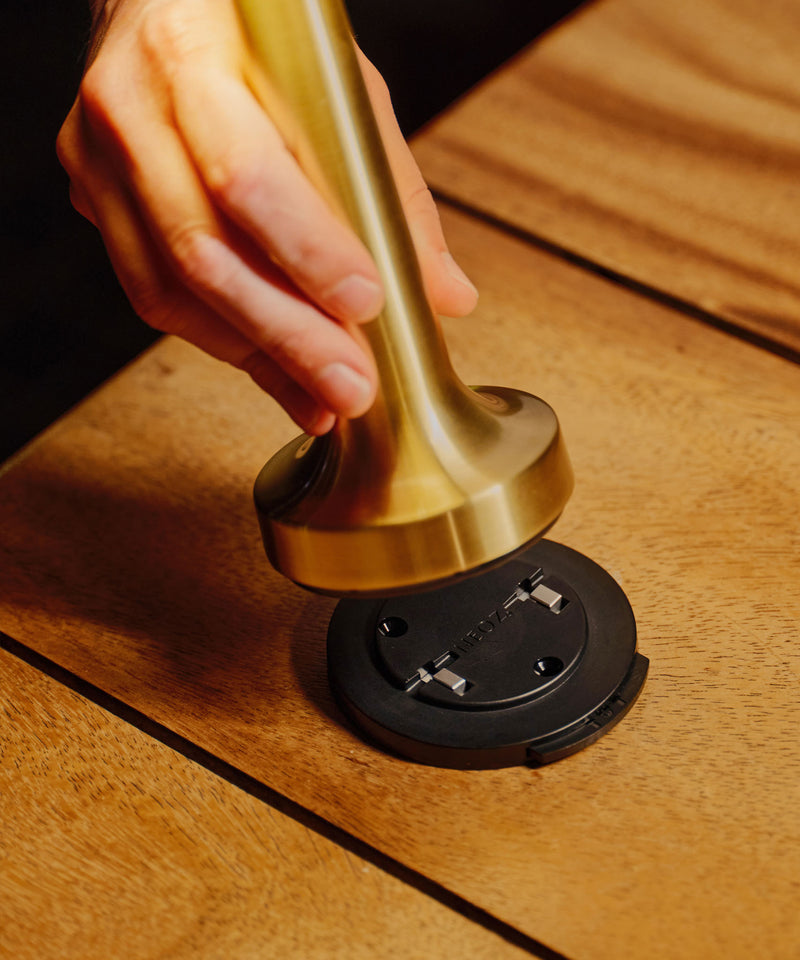 Close-up of NEOZ N1 Cordless Lamp Lock base plate as a Cooee 1C Brass lamp is fitted at 6HEAD Sydney